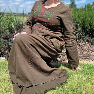 Honey-embroidered-maxi-dress-in-khaki-brown-featuring-embroidery-on-bust-and-front-pockets-front-close-up-view