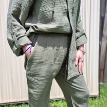 Load image into Gallery viewer, muslin-women&#39;s-tie-waist-pants-featuring-elasticated-string-tie-waist-and-side-pockets-in-khaki-worn-with-Ada-muslin-hooded-shirt-in-khaki-close-up-view
