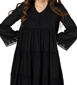 Sharon_tiered_midi_dress_in_black_with_Vneckline_fitted_buttoned_bust_tiered_skirt_with_lace_trim_at_hem_and_bell_sleeves_with_lace_trim_studio_image_close_up