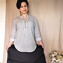 Load image into Gallery viewer, amber-buttoned-Vneck-blouse-with-rolled-up-button-tab-long-sleeves-in-stone-front-view-with-dahlia-maxi-skirt-in-black
