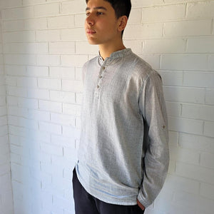 long-sleeve-men's-shirt-with-buttoned-band-collar-and-button-tab-sleeves-in-light-grey-close-up-view