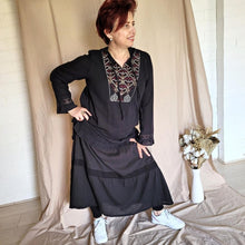 Load image into Gallery viewer, dahlia-tiered-maxi-skirt-with-lace-trim-in-black-worn-with-embroidered-tunic-in-black-and-white-casual-shoes-front-view
