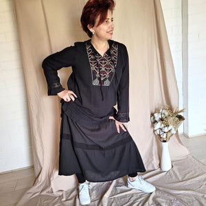 dahlia-tiered-maxi-skirt-with-lace-trim-in-black-worn-with-embroidered-tunic-in-black-and-white-casual-shoes-front-view