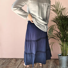 Load image into Gallery viewer, dahlia-tiered-maxi-skirt-with-lace-trim-in-navy-worn-with-V-neck-blouse-in-stone-and-brown-leather-sandals-view-view
