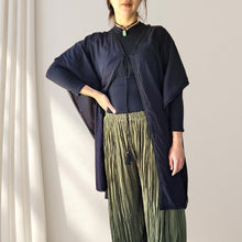 Load image into Gallery viewer, cotton-kimono-tunic-with-V-neckline-short-batwing-sleeves-and-straight-hemline-with-lace-edging-and-front-string-tie-with-tassel-trim-in-black-worn-with-khaki-crinkle-harem-pants-and-black-top-front-view
