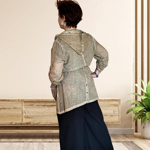 delta-hooded-tunic-with-button-tab-long-sleeves-drawstring-waist-and-front-pockets-in-light-brown-back-view-showing-buttoned-slit