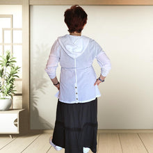 Load image into Gallery viewer, delta-hooded-tunic-with-button-tab-long-sleeves-drawstring-waist-and-front-pockets-in-white-back-view-showing-buttoned-slit
