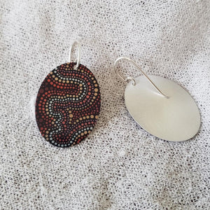 handmade-flat-oval-earrings-featuring-essence-at-dusk-indigenous-artwork-imprinted-on-aluminium-sheeting-with-sterling-silver-hooks-front-and-back