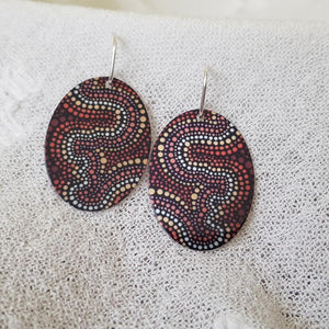 handmade-flat-oval-earrings-featuring-essence-at-dusk-indigenous-artwork-imprinted-on-aluminium-sheeting-with-sterling-silver-hooks