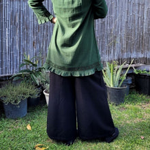 Load image into Gallery viewer, Luna high-waisted, wide leg, brushed cotton, women&#39;s pants in black with green tunic viewed from the back
