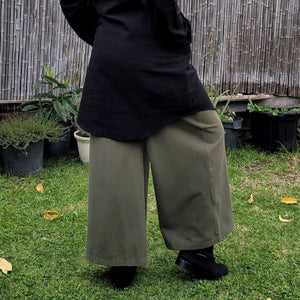 Luna high-waisted, wide leg, brushed cotton, women's pants in khaki, worn with black tunic, viewed from the side 