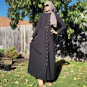 long-sleeve-button-through-cotton-maxi-dress-in-black-with-fabric-belt-shirt-collar-buttoned-cuffs-and-gathered-tier-in-skirt-from-the-hips