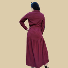 Load image into Gallery viewer, long-sleeve-button-through-cotton-maxi-dress-in-burgundy-with-fabric-belt-shirt-collar-buttoned-cuffs-and-gathered-tier-in-skirt-from-the-hips-back-view
