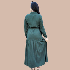 long-sleeve-button-through-cotton-maxi-dress-in-green-with-fabric-belt-shirt-collar-buttoned-cuffs-and-gathered-tier-in-skirt-from-the-hips-back-view