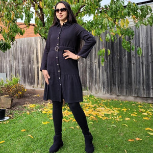 sile-cotton-button-through-tunic-dress-in-black-with-shirt-collar-fabric-belt-ruffle-hem-and-long-sleeves-with-button-tabs