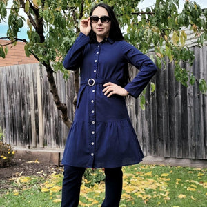 sile-cotton-button-through-tunic-dress-in-navy-with-shirt-collar-fabric-belt-ruffle-hem-and-long-sleeves-with-button-tabs