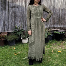 Load image into Gallery viewer, long-sleeve-cotton-maxi-dress-in-khaki-with-eyelet-embroidery-on-front-sides-pintuck-detail-on-chest-lace-frill-at-skirt-hem-and-string-tie-at-waist-back
