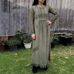 long-sleeve-cotton-maxi-dress-in-khaki-with-eyelet-embroidery-on-front-sides-pintuck-detail-on-chest-lace-frill-at-skirt-hem-and-string-tie-at-waist-back