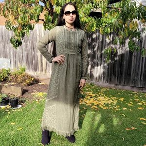 long-sleeve-cotton-maxi-dress-in-khaki-with-eyelet-embroidery-on-front-sides-pintuck-detail-on-chest-lace-frill-at-skirt-hem-and-string-tie-at-waist-back