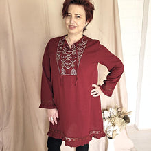 Load image into Gallery viewer, selena-long-sleeve-tunic-with-round-string-tie-neck-embroidery-on-chest-panel-and-lace-detail-and-ruffles-on-the-sleeve-ends-and-hemline-in-crimson-front-view
