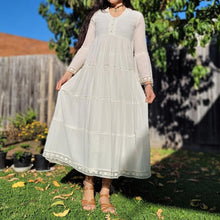 Load image into Gallery viewer, Sharon_tiered_midi_dress_in_cream_with_Vneckline_fitted_buttoned_bust_tiered_skirt_with_lace_trim_at_hem_and_bell_sleeves_with_lace_trim_in_garden
