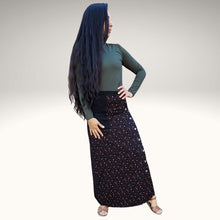 Load image into Gallery viewer, high-waisted-brushed-cotton-flannel-maxi-skirt-in-black-with-ditsy-floral-print-accent-pocket-on-front-right-in-solid-black-and-button-through-off-centre-front-slit-full-front-view
